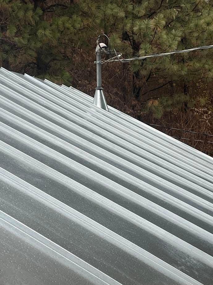 Galvanized  Standing Seam with a seamed in cone flashing.