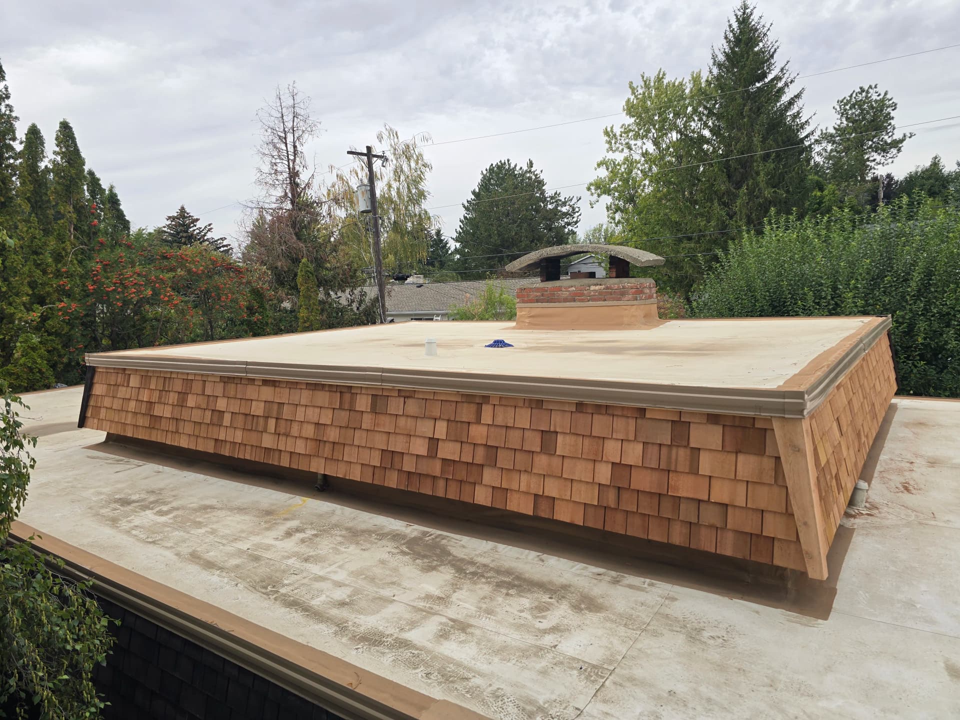 Fresh Cedar Shingles on a Flat Roof Parapet Wall image