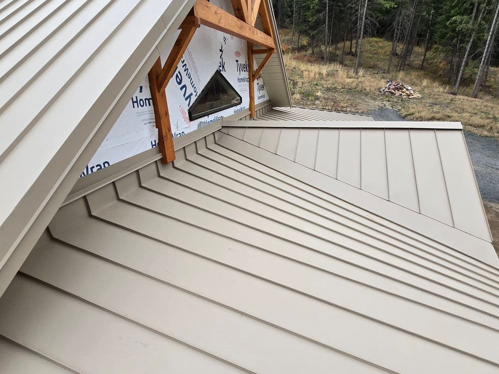 Tapered Panels and Custom Chimney Cricket on Standing Seam Metal Roof image